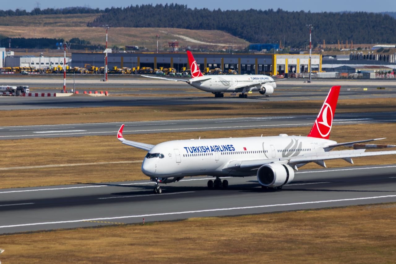 Turkish Airlines aircraft on the runway at Istanbul Airport, showcasing aviation and travel transportation.